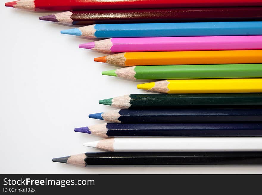 Close up of many colored pencils isolated