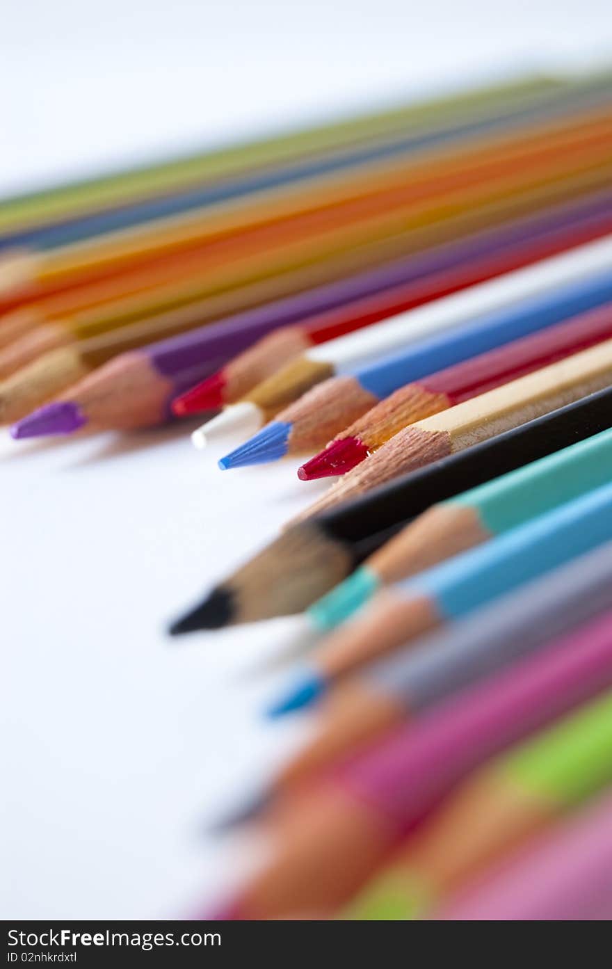 Close up of many colored pencils isolated