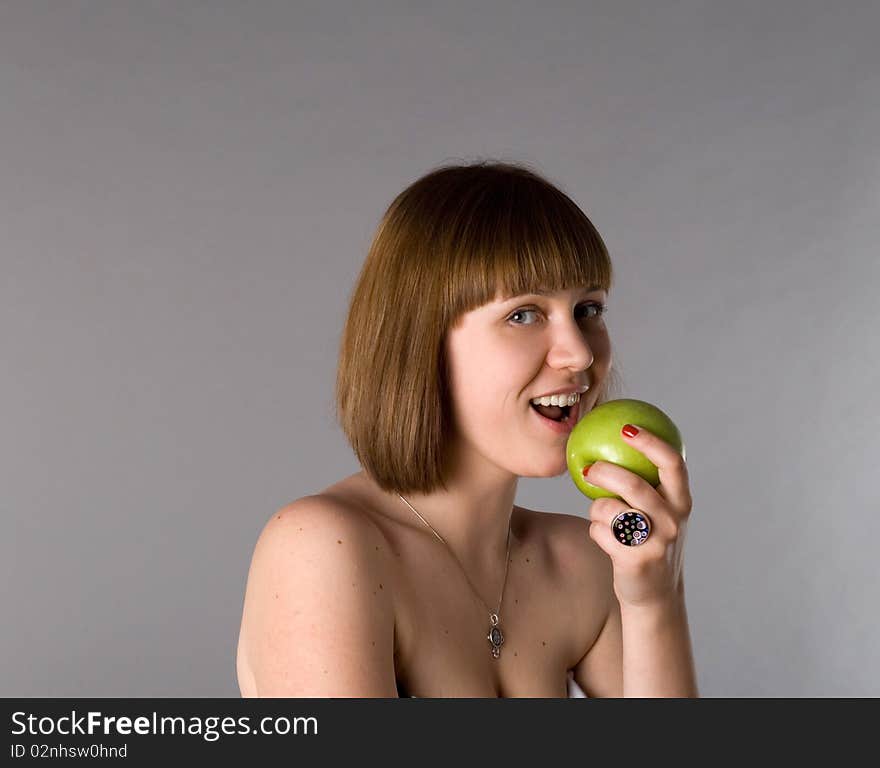 Woman with apple studio shot