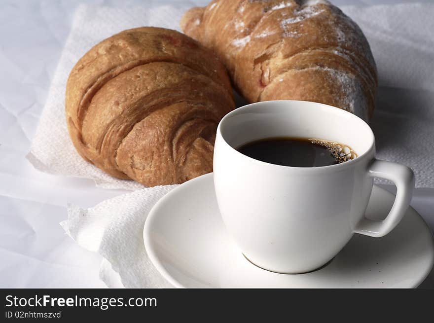 Cup of coffee with two croissants. Cup of coffee with two croissants