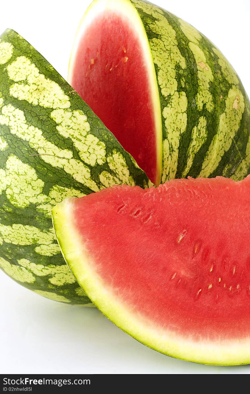 Piece cut out of watermelon on the white background. Piece cut out of watermelon on the white background