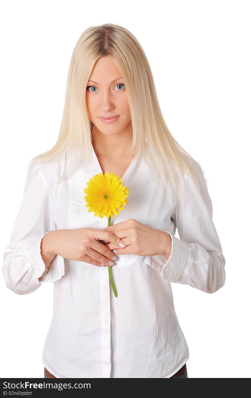 Young charming blonde is playing with a yellow flower isolated on white background