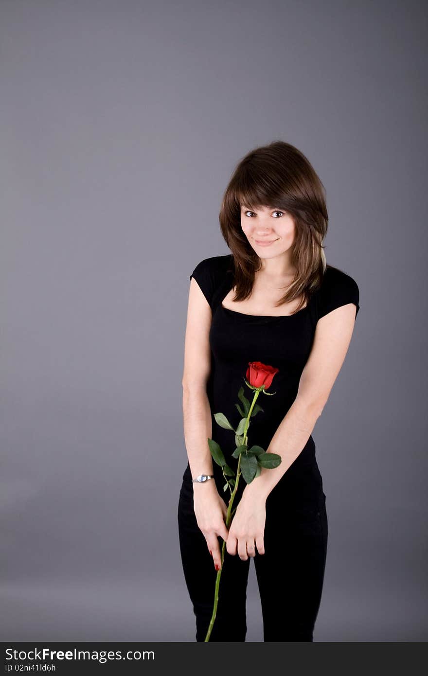 Beautiful girl with rose studio shot