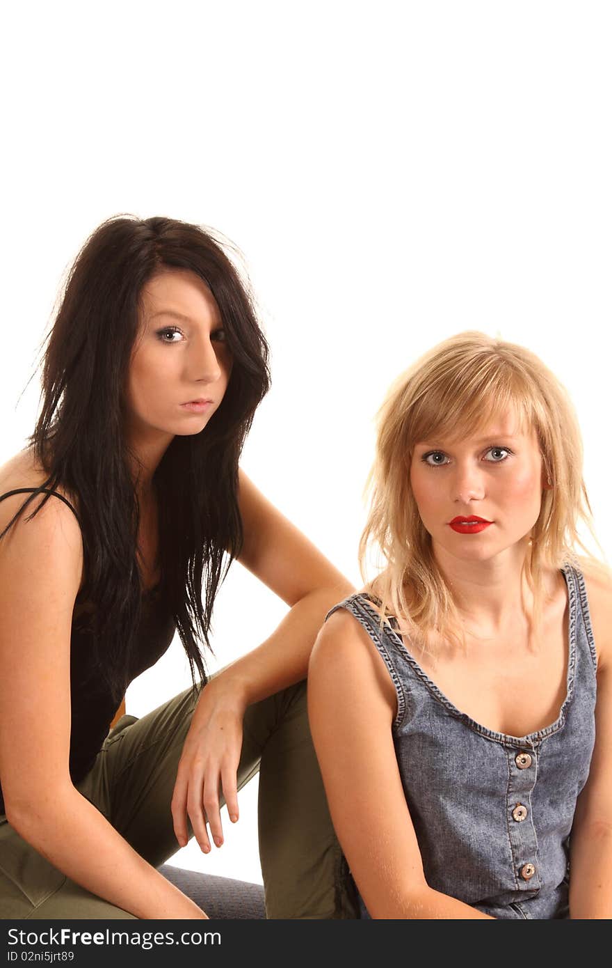 Two attractive teenage girls posing together for portraits. Two attractive teenage girls posing together for portraits