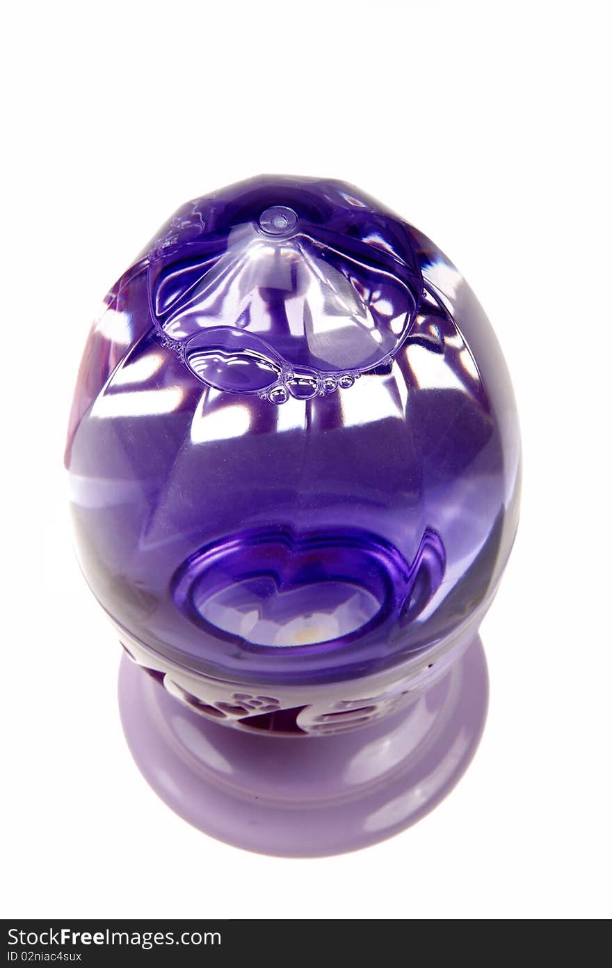 Purple perfume bottle isolated on white