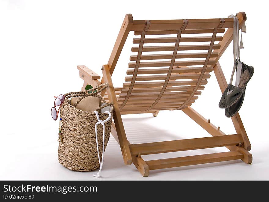 Beach chair, bag, espadrilles, on a white background. Beach chair, bag, espadrilles, on a white background.