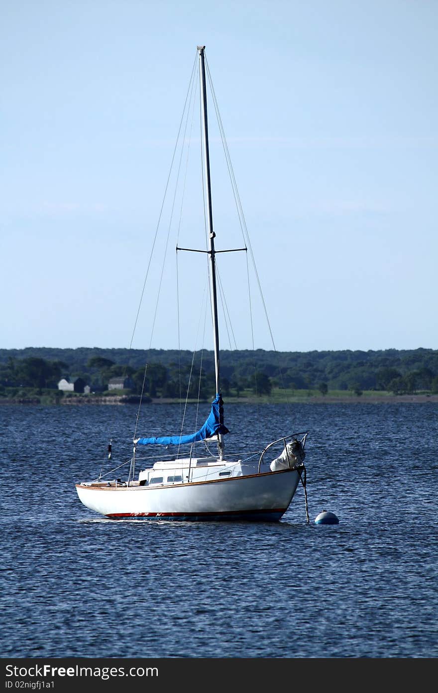 Moored White Sailboat