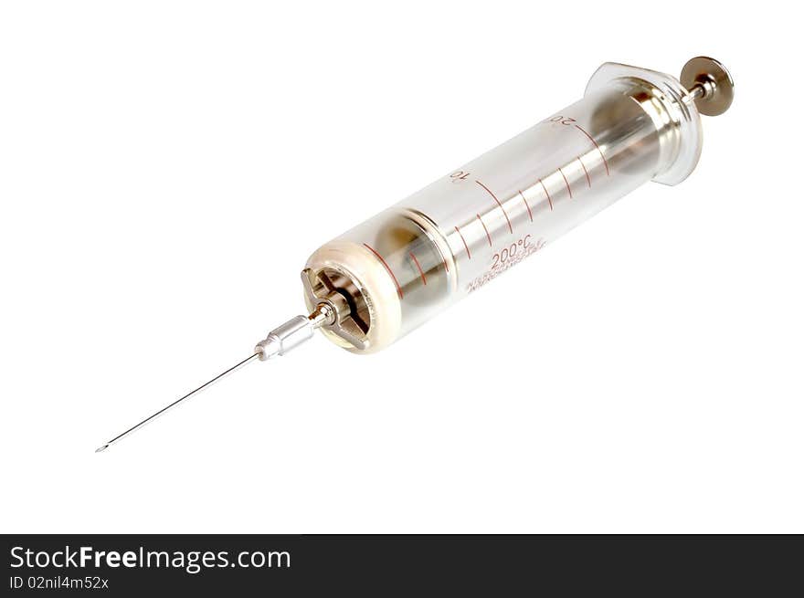 Old glass syringe against white background