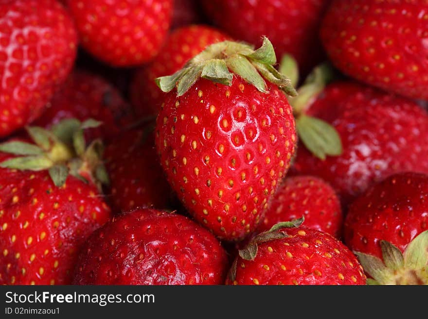 Close-up view of fresh strawberry. Selective focus on central berry