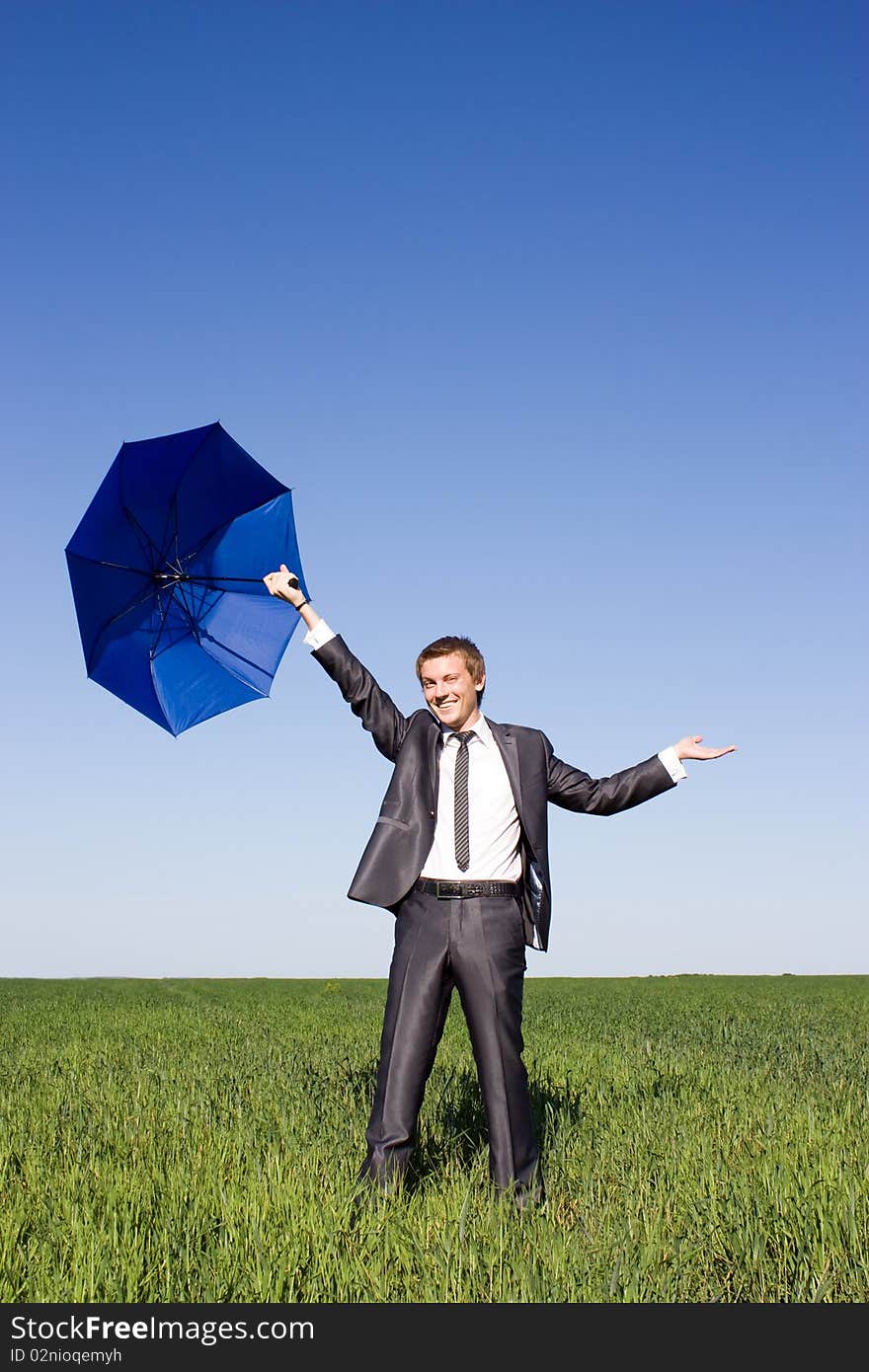 Businessman Outdoors Holding an Umbrella