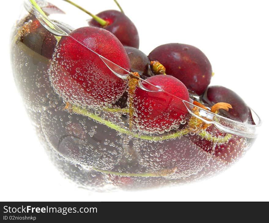 Ripe cherry in the soda isolated white background