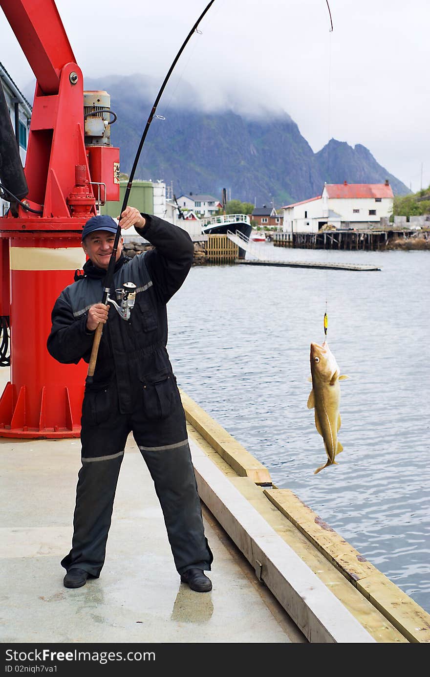 The fisherman on the pier on Lofoten island