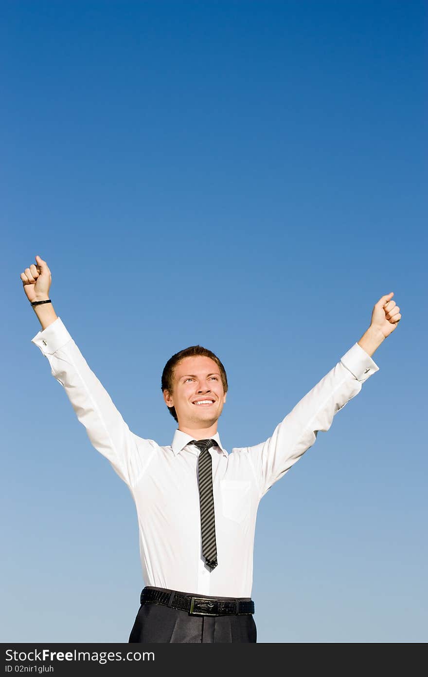 Businessman in a white shirt with his hands up. Businessman in a white shirt with his hands up