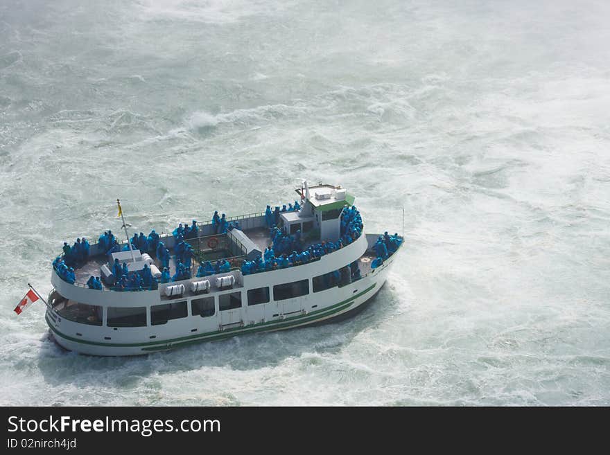 Boat in a storm water , with passenger on the deck