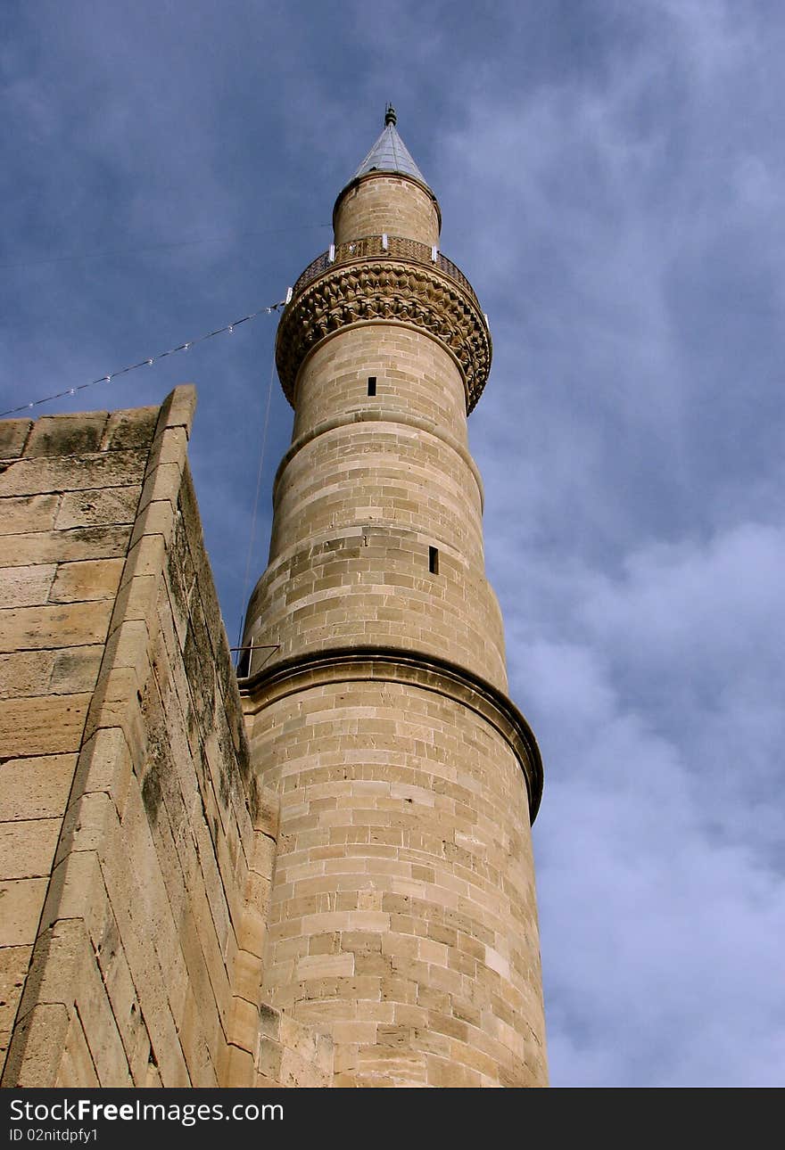 Cyprian sandstone minaret heading towards the blue sky