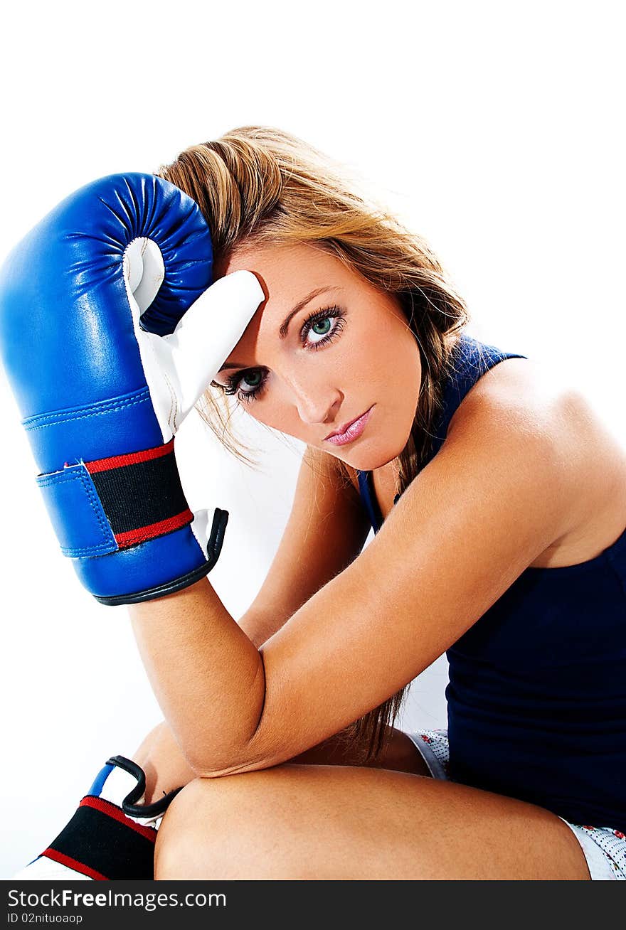 Girl with a tired face with boxing gloves. Girl with a tired face with boxing gloves