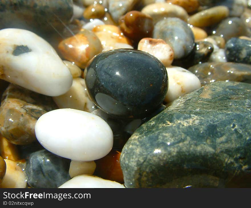 Glistening shinny pebbles on cornish shores. Glistening shinny pebbles on cornish shores