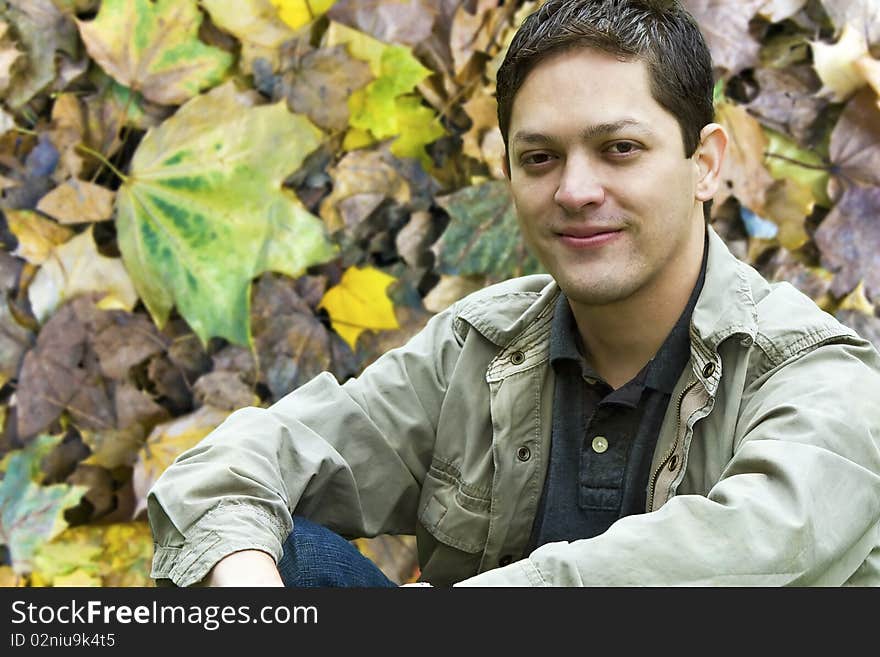 Guy against a fall Season Foliage Background. Guy against a fall Season Foliage Background.