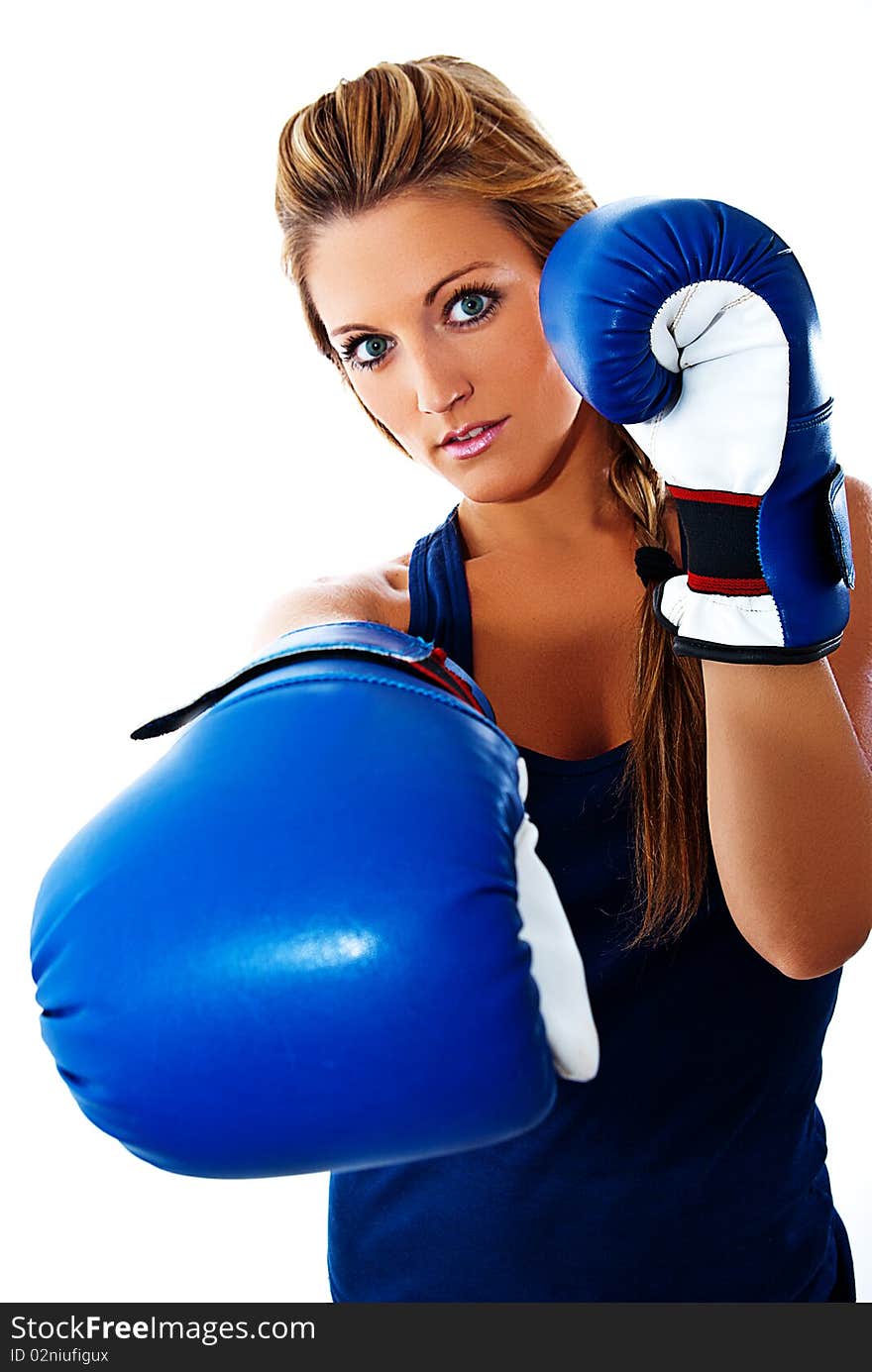 Blonde girl giving a blow in boxing. Blonde girl giving a blow in boxing