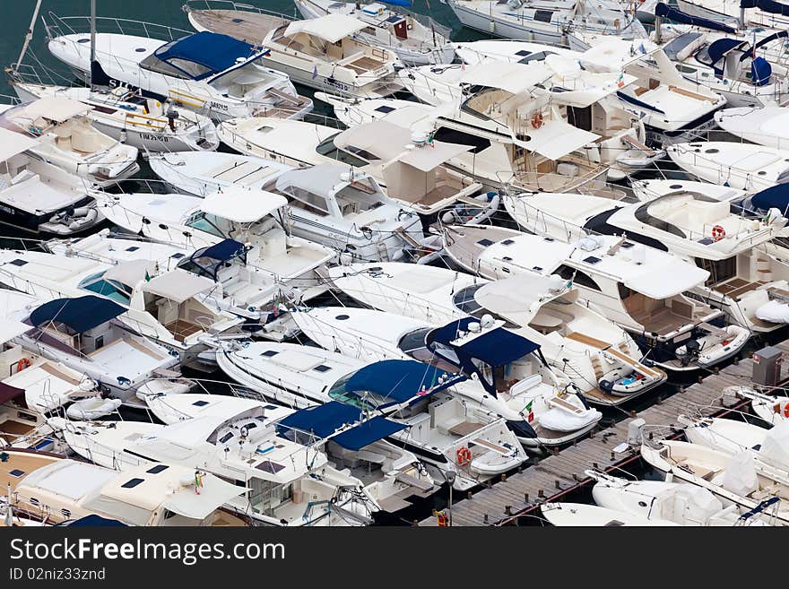 Large parking boats at sea in a small seaside town