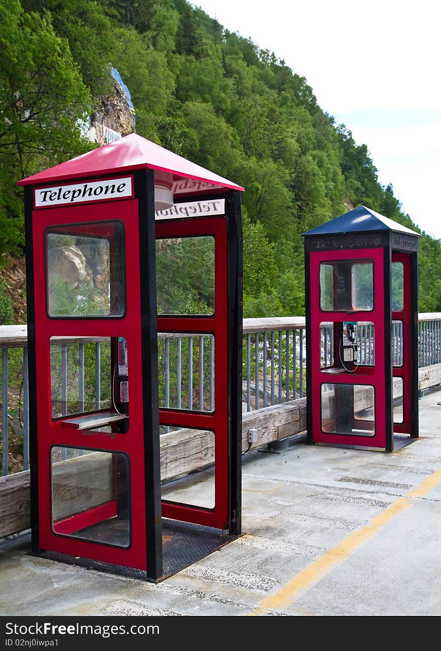 Two public telephone booths side by side