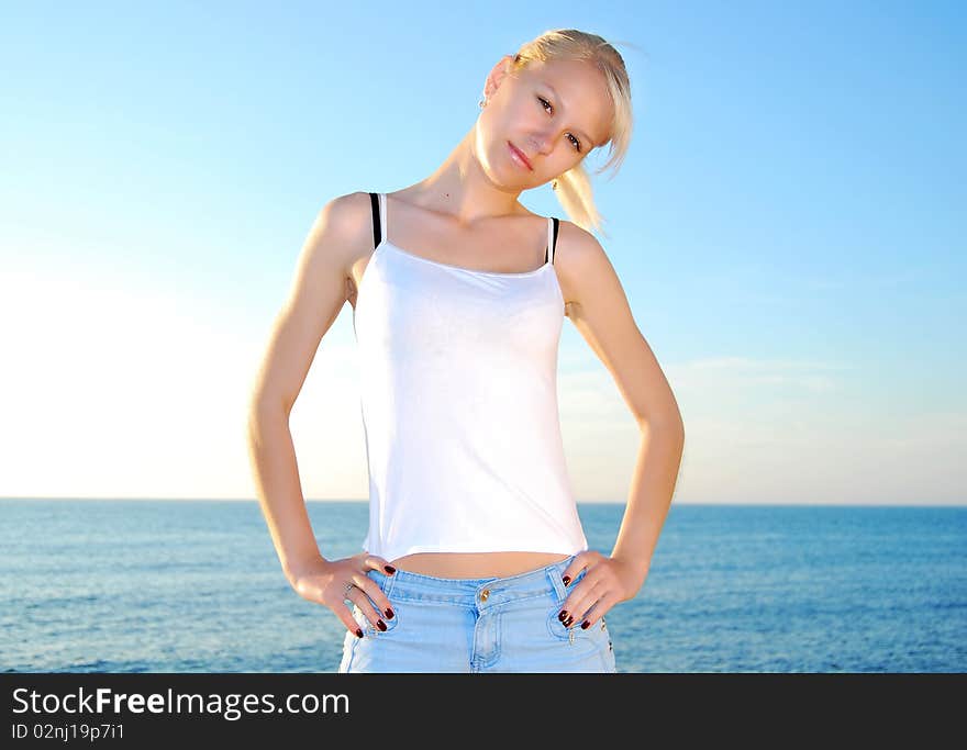 Fit girl working out at the seashore. Fit girl working out at the seashore