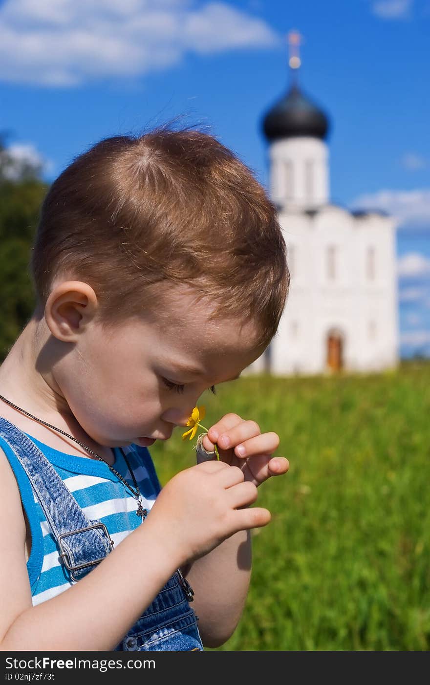 Little boy on a  orthodox church background