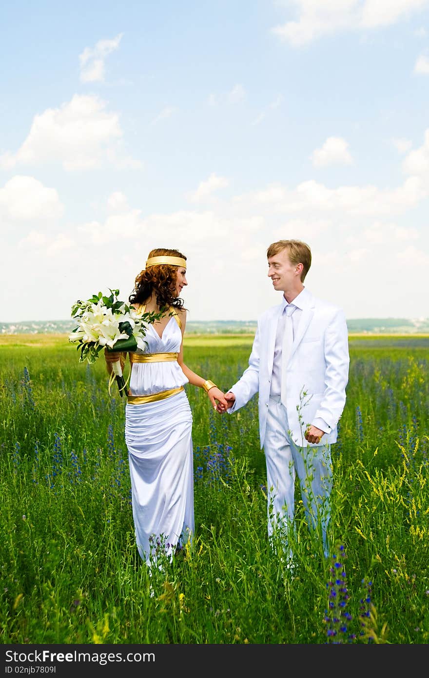 Just married couple on field