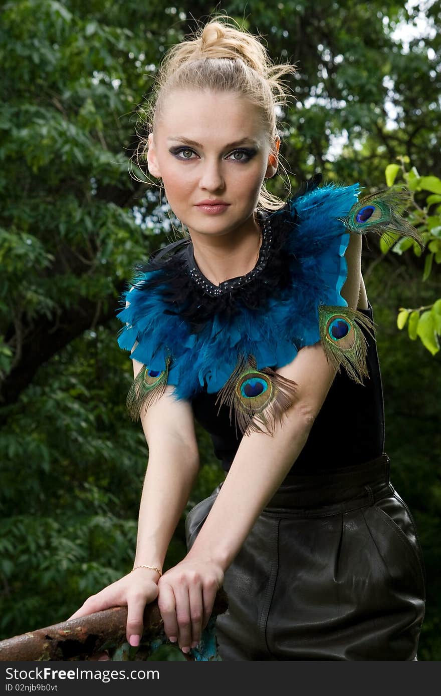 Portrait Of Girl In Blouse With Peacock Feathers