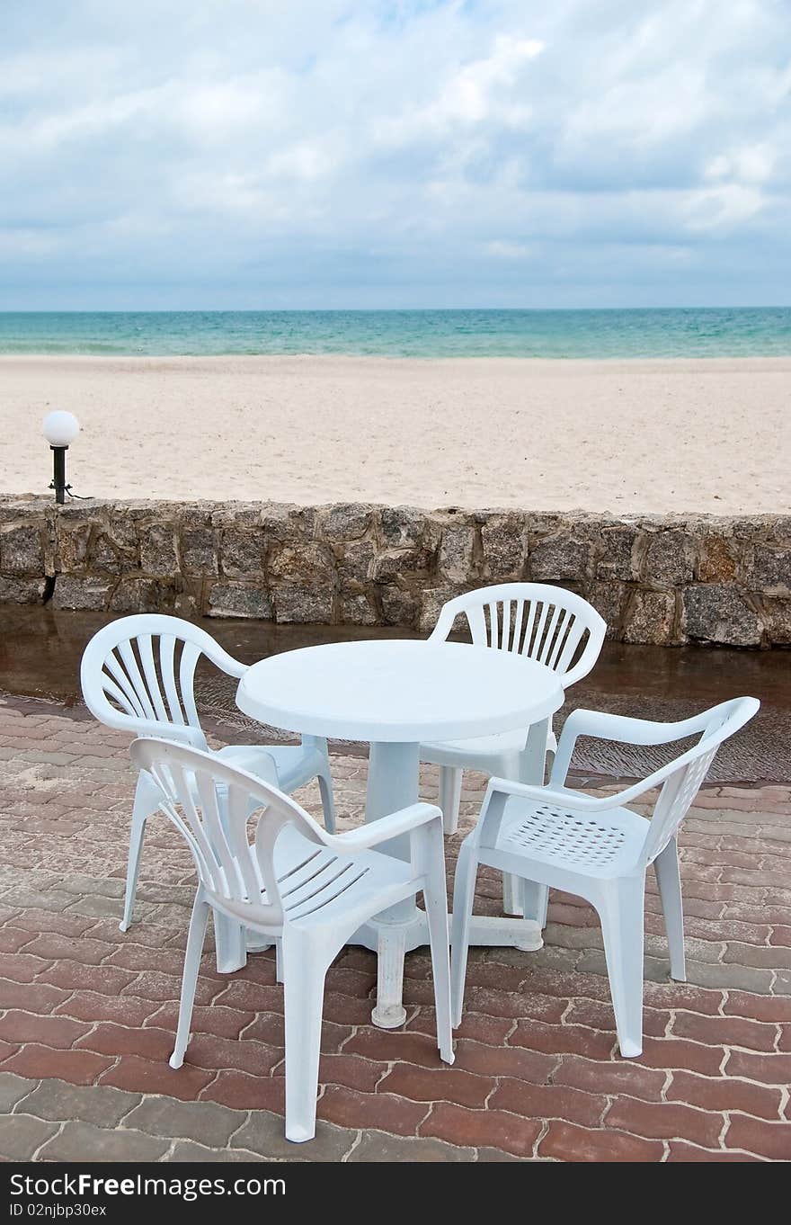 Empty table and chairs in the beach near sea. Empty table and chairs in the beach near sea