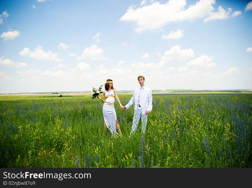 Just married couple on the green field. Just married couple on the green field