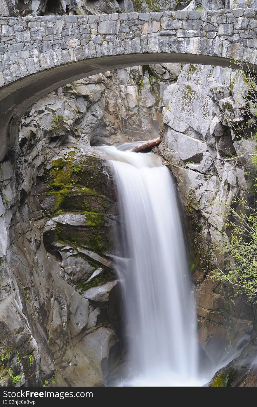 Water falls under bridge