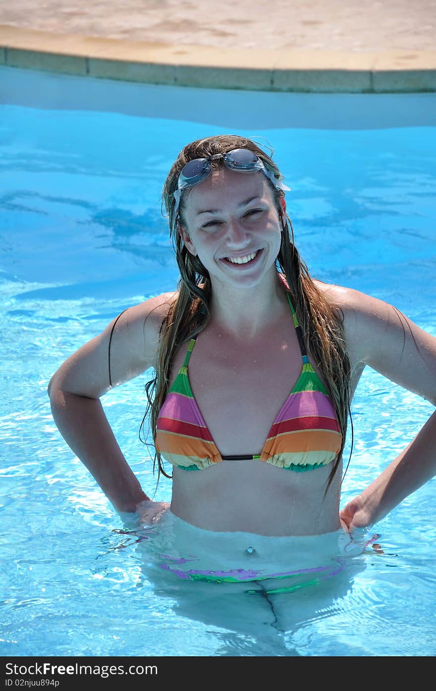 Beautiful woman at the swimming pool