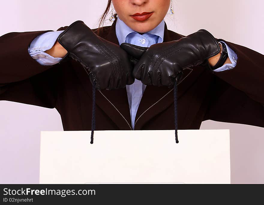 Female hands holding a paper bag