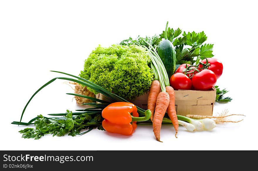 Juicy vegetables in punnet on white background