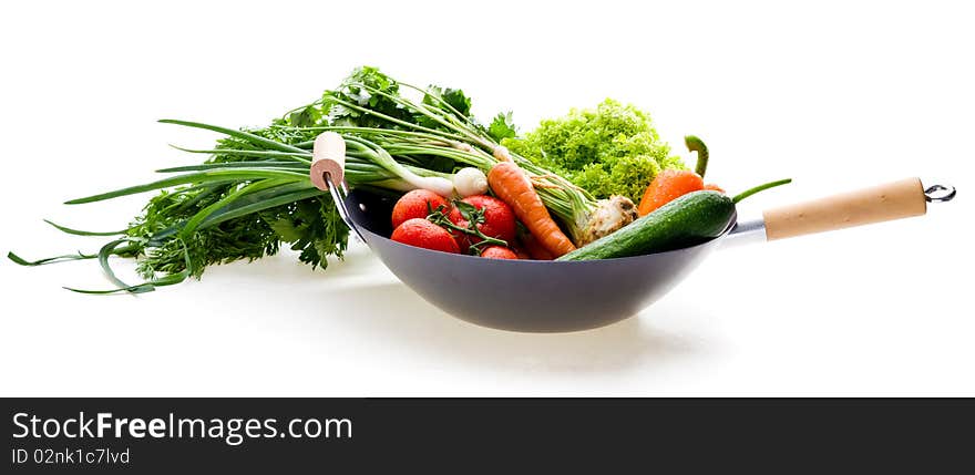 Fresh vegetables in chinesse wok on white background