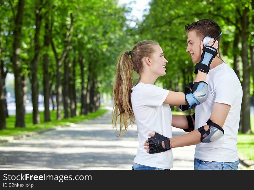 The girl in the outfit of a young boy wearing headphones. The girl in the outfit of a young boy wearing headphones