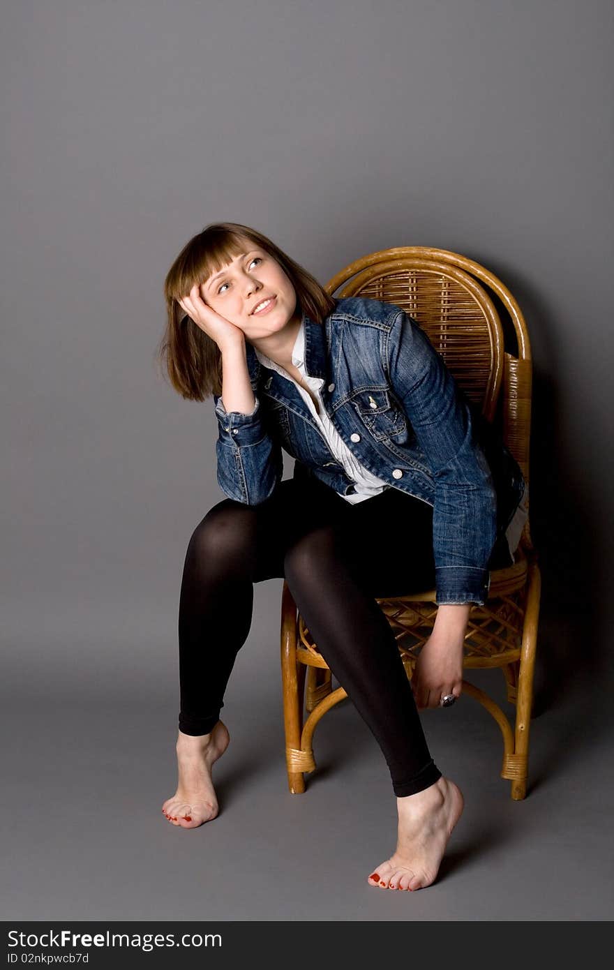 Attractive girl sitting on chair