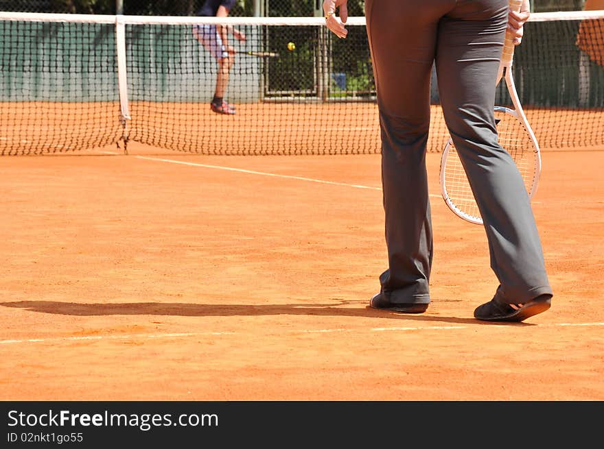 Young female playing tennis