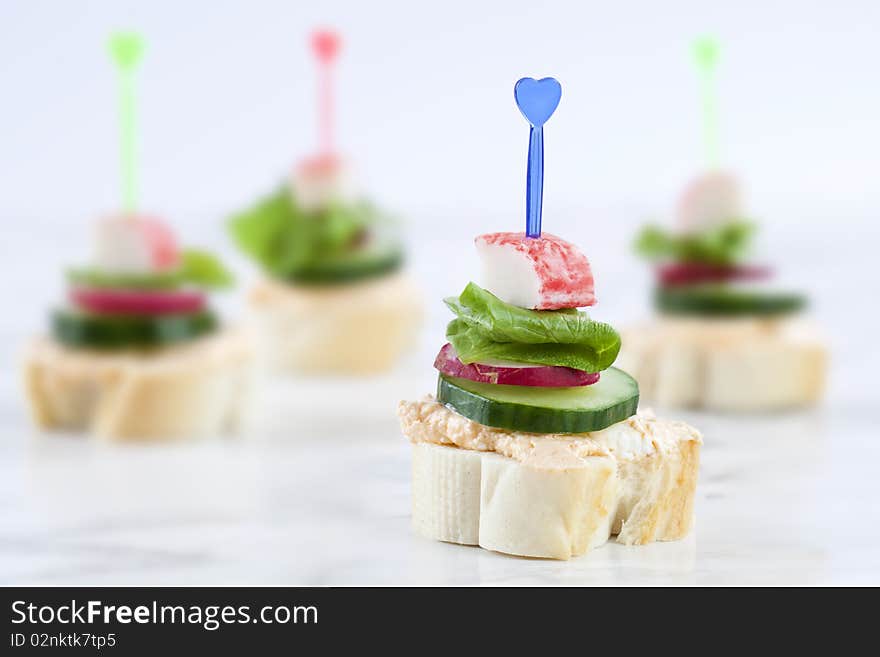 Close up of slam sandwiches of french roll and some veggies. Close up of slam sandwiches of french roll and some veggies