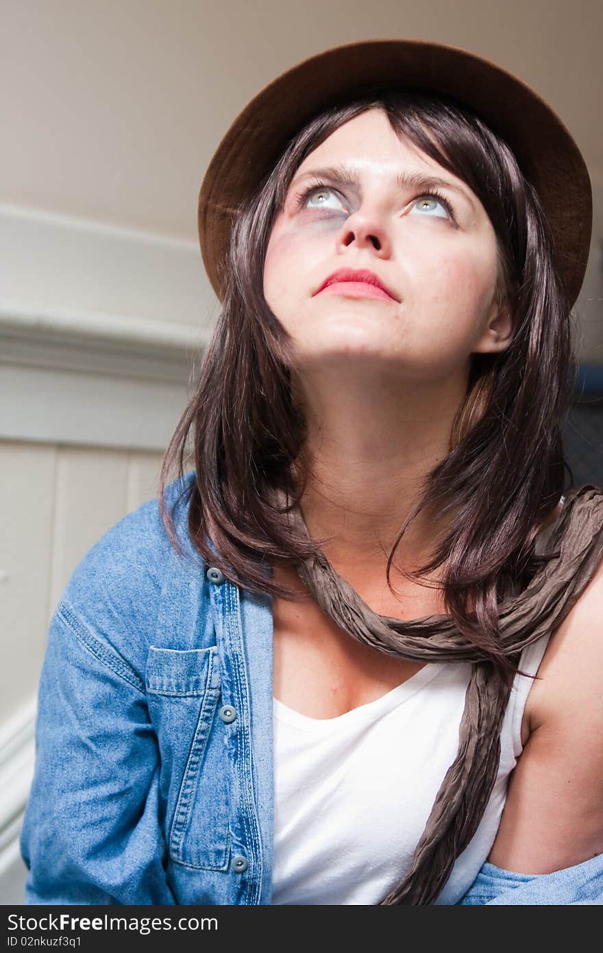 Young woman with bruised eye staring upwards. Young woman with bruised eye staring upwards