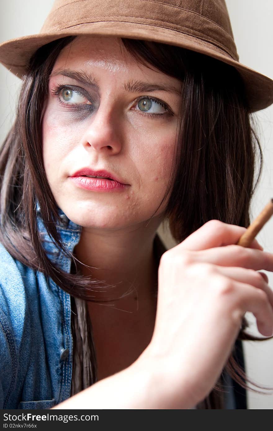 Fashionable Young Woman with Bruised Eye Smoking Cigar