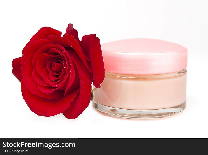 Closeup of jar of moisturizing face cream and fresh red rose. Closeup of jar of moisturizing face cream and fresh red rose