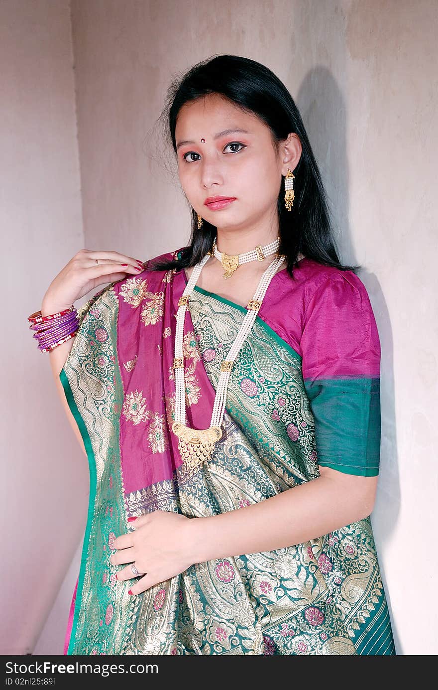 A young Indian woman with traditional Saree.