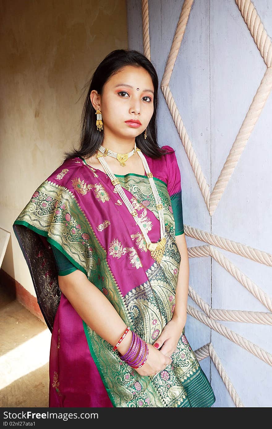 A young Indian woman with traditional Saree