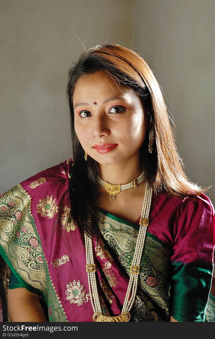 A young Indian woman with traditional Saree