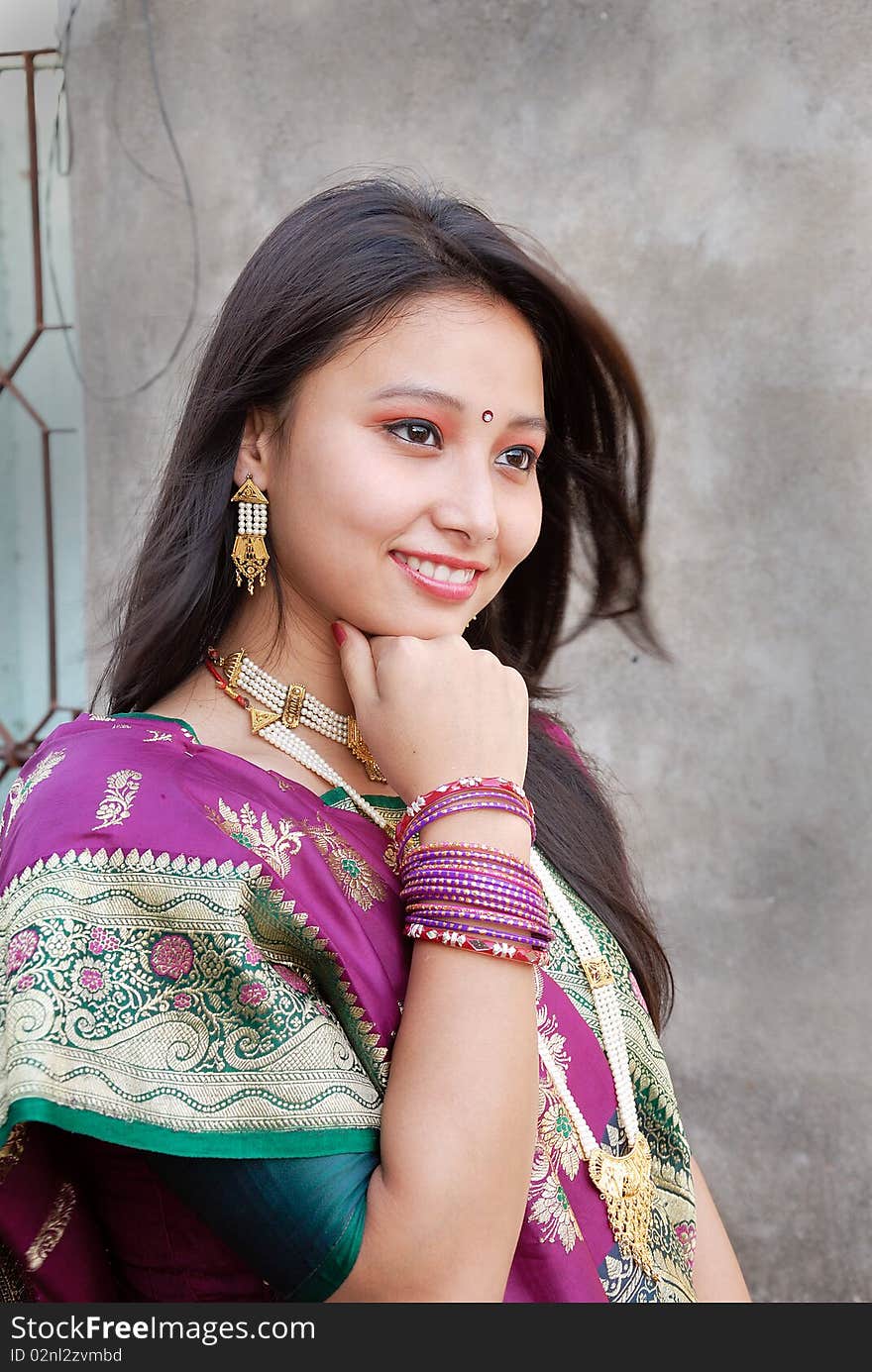 A young Indian woman with traditional Saree