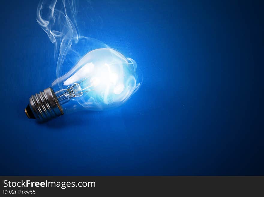 shone electric bulb on a dark blue background. shone electric bulb on a dark blue background