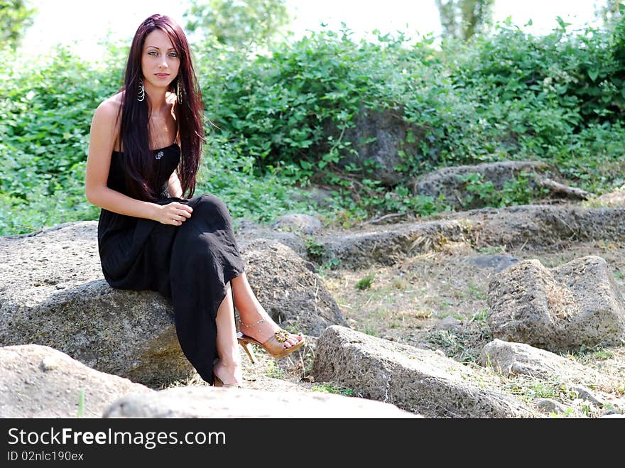 Beautiful girl posing and watching in the camera. Beautiful girl posing and watching in the camera