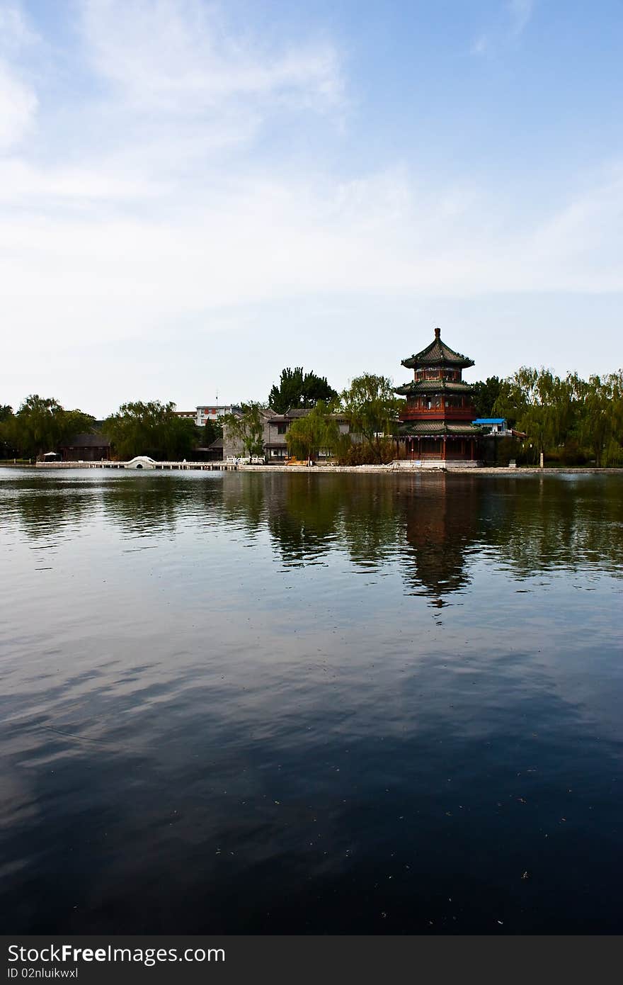 View of lake and ancient tower in Beijing, close to Forbidden City. View of lake and ancient tower in Beijing, close to Forbidden City